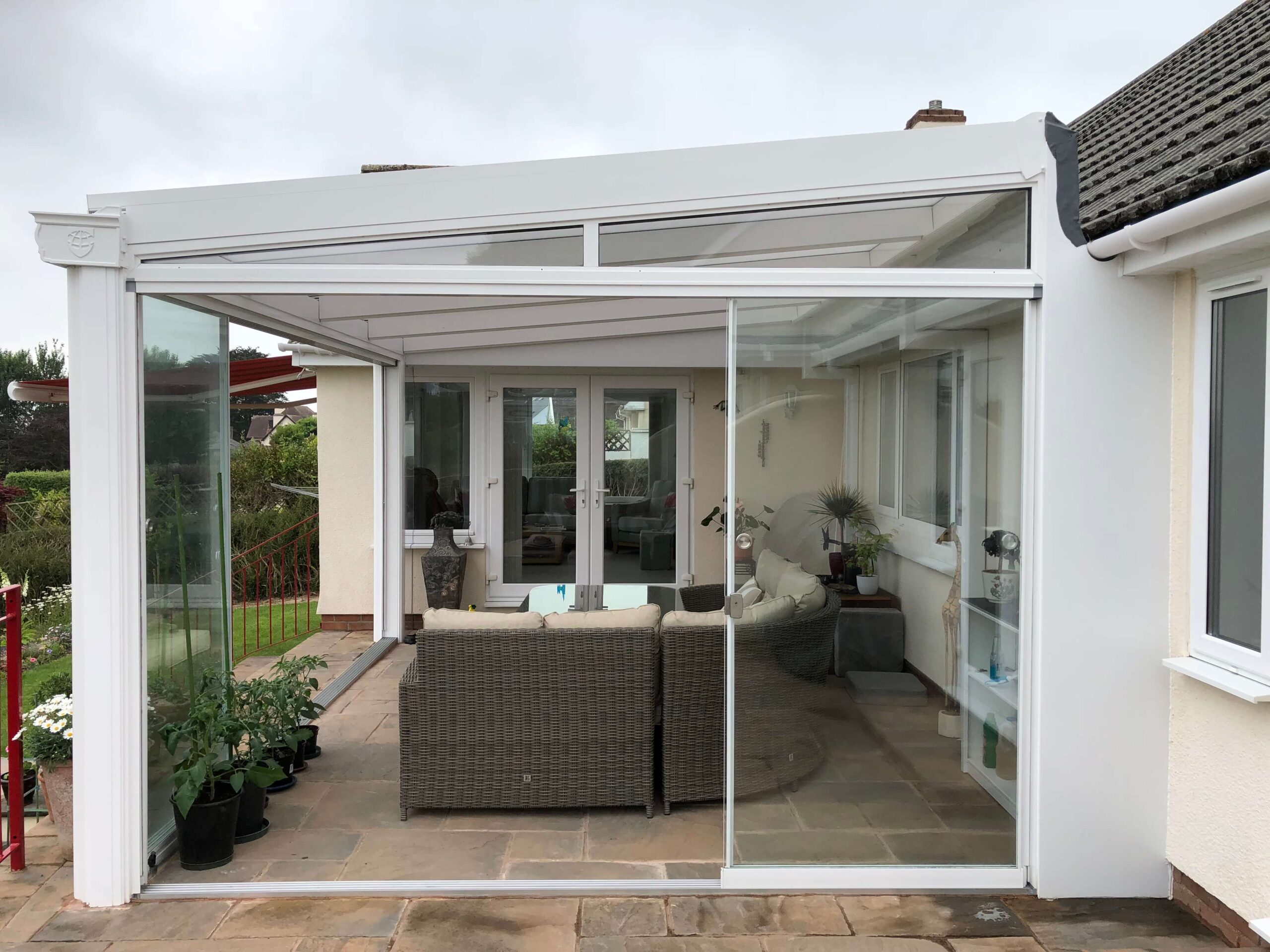 glass room in white with sliding doors installed in Barnstaple, Devon
