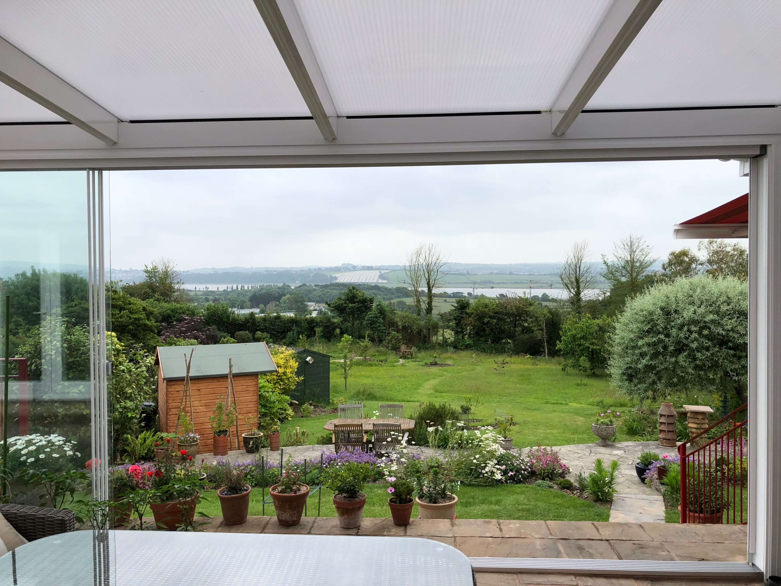looking out of glass room in white with sliding doors installed in Barnstaple, Devon