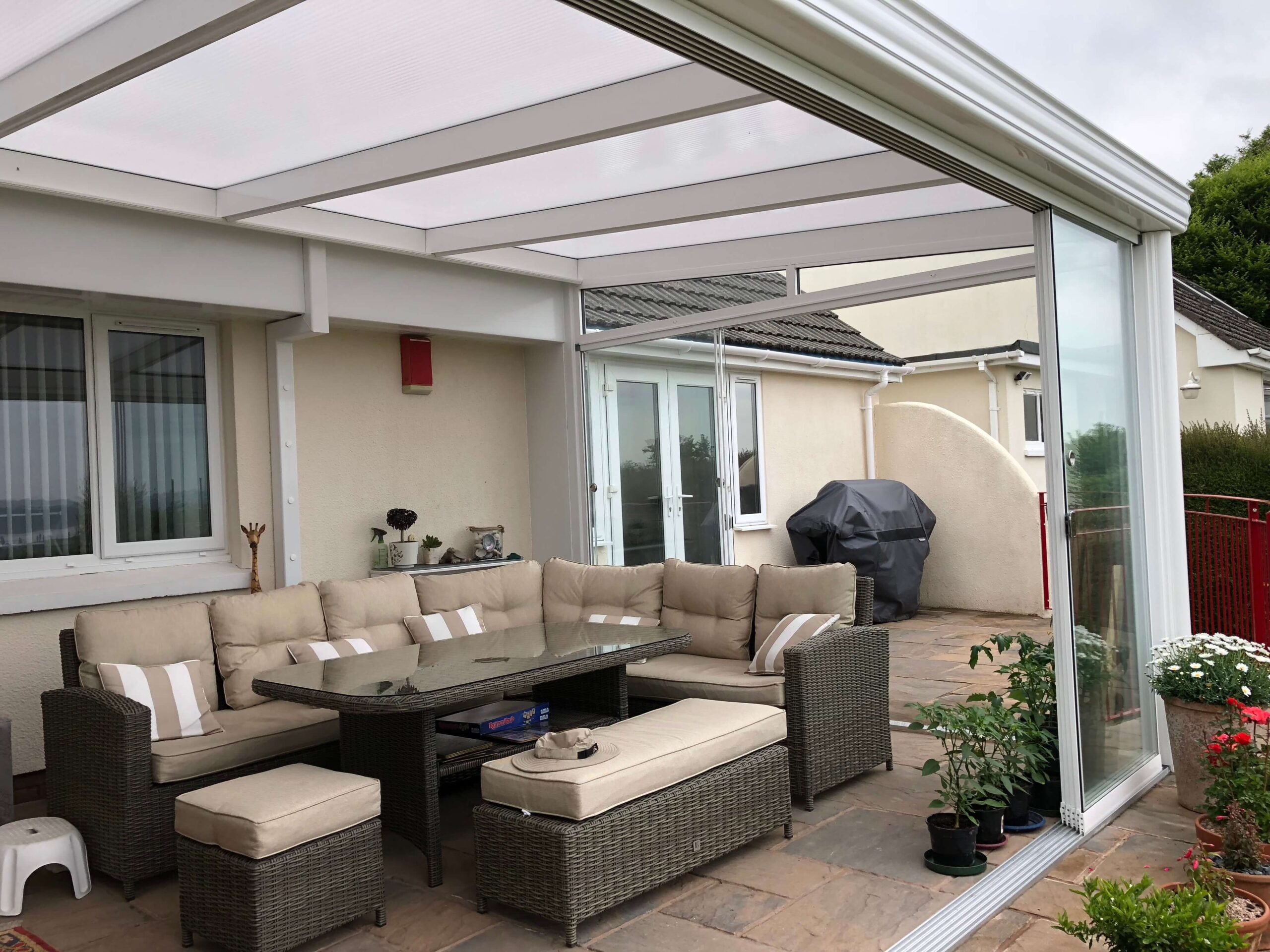 glass room in white with sliding doors installed in Barnstaple, Devon