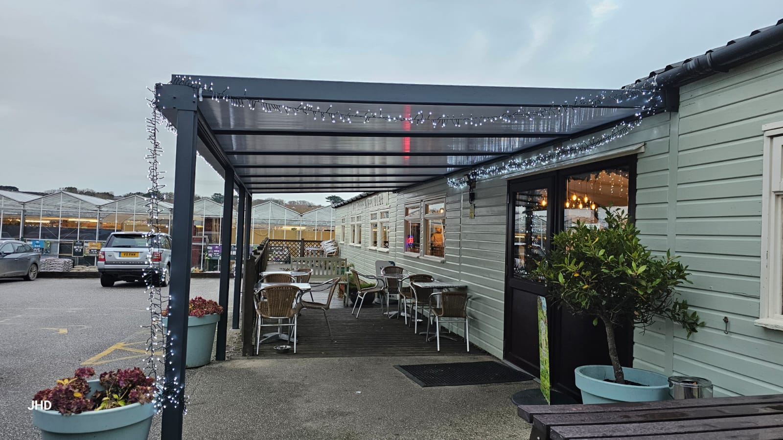 Veranda canopy structure with a transparent roof at Goonhavern Garden Centre in Truro, Cornwall.
